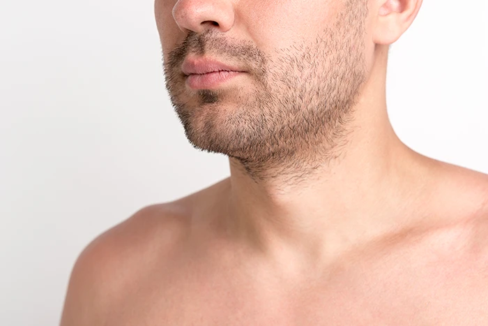 A closeup of a man’s jawline
