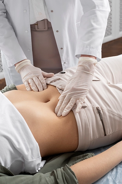 A cosmetic surgeon checking a patient before surgery